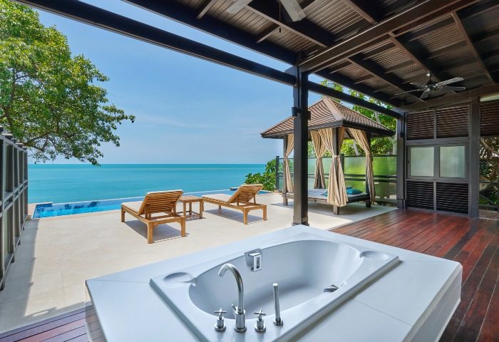 Garrya Tongsai Bay Samui luxury gay hotel. Pool villa with private beach, bathtub, sun loungers, and gazebo overlooking the ocean.
