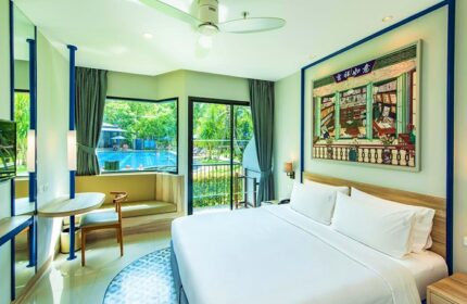Holiday Inn Express Krabi Ao Nang Beach hotel room. Modern decor, pool view, and a king-size bed. Perfect for gay beach travel in Krabi.