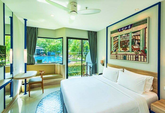 Holiday Inn Express Krabi Ao Nang Beach hotel room. Modern decor, pool view, and a king-size bed. Perfect for gay beach travel in Krabi.