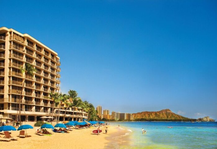 OUTRIGGER Reef Waikiki Beach Resort, a gay-friendly hotel. Beach view with Diamond Head. Ideal for gay men's travel in Waikiki.