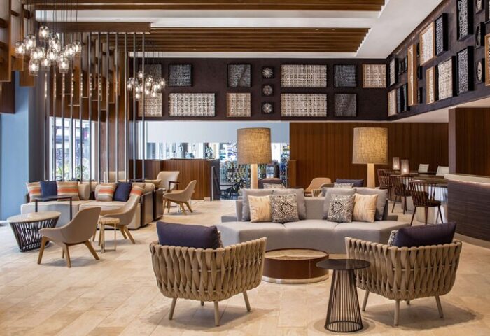 Hilton Garden Inn Waikiki Beach lobby. Stylish seating area, modern decor. A gay-friendly hotel, perfect for your travel plans.