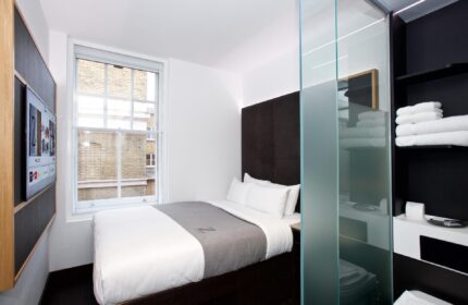 The Z Hotel Covent Garden room. Gay-friendly hotel with single bed, TV, and frosted glass bathroom. Ideal for gay men travel in London.