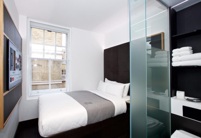 The Z Hotel Covent Garden room. Gay-friendly hotel with single bed, TV, and frosted glass bathroom. Ideal for gay men travel in London.