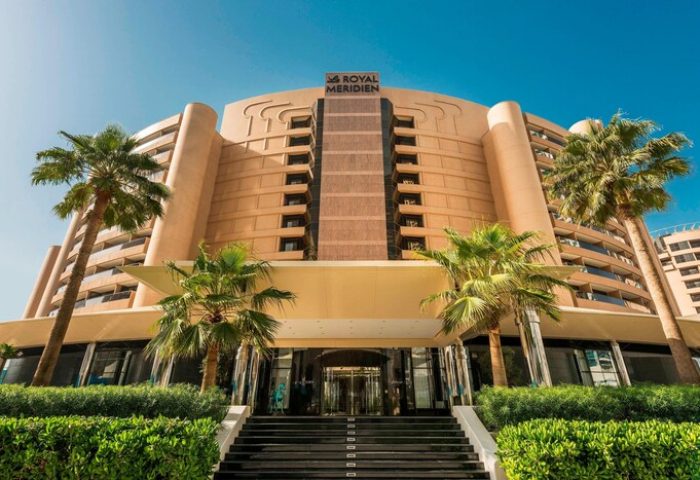 Le Royal Méridien Beach Resort & Spa entrance. Gay-friendly hotel with palm trees. A great choice for gay travelers.