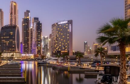 Hotel Indigo Dubai Downtown, a gay-friendly hotel. Skyline view with boats in the marina. Ideal for gay travel and downtown Dubai exploration.