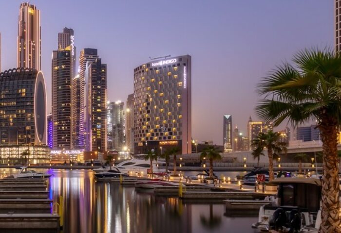 Hotel Indigo Dubai Downtown, a gay-friendly hotel. Skyline view with boats in the marina. Ideal for gay travel and downtown Dubai exploration.