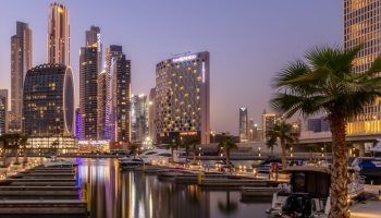 Hotel Indigo Dubai Downtown, a gay-friendly hotel. Skyline view with boats in the marina. Ideal for gay travel and downtown Dubai exploration.