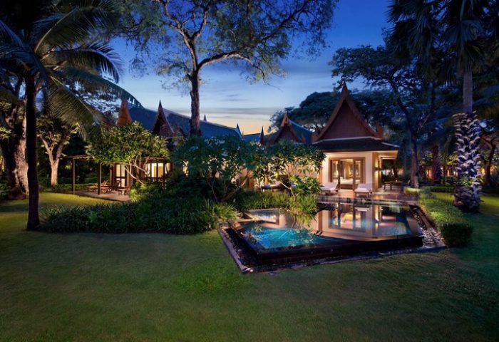 The Barai Hyatt gay-friendly hotel: Thai villa with pool at dusk. Lush gardens, serene ambiance, perfect for gay men's travel.