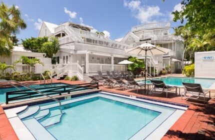 NYAH Key West adults-only gay-friendly hotel. Pools and lounge chairs at this Key West hotel offer a relaxing vacation experience.