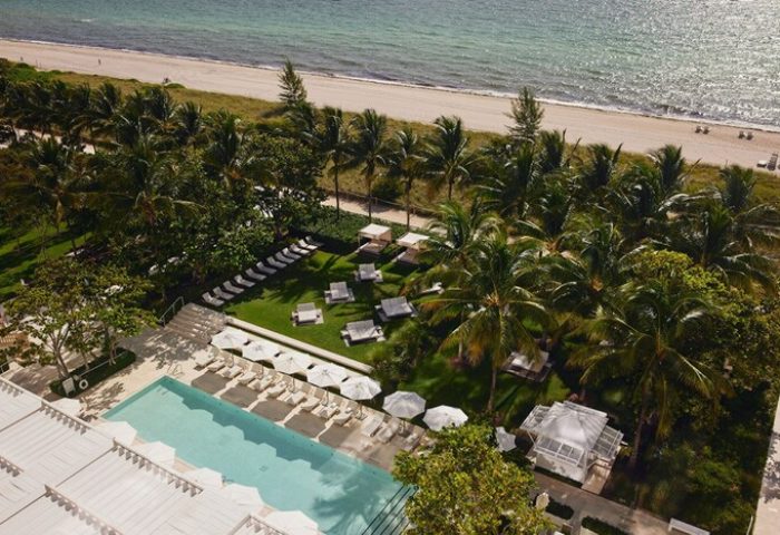 Four Seasons Hotel at The Surf Club aerial view. Gay-friendly hotel with pool, beach, palm trees, and cabanas. Luxury travel for gay men.