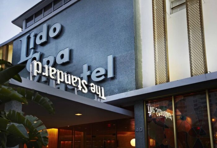 The Standard Miami, a gay-friendly hotel. Facade with Lido Spa and The Standard signage. A great choice for gay men's travel in Miami.