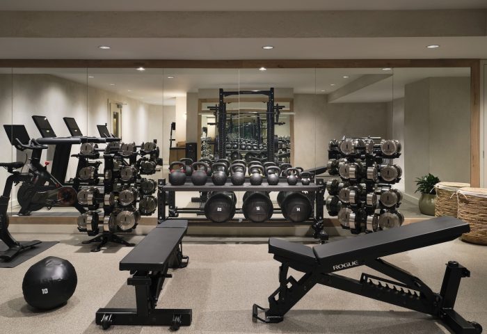 Gym at 1 Hotel San Francisco, a gay-friendly hotel. Weights, kettlebells, benches, and exercise bikes for a complete workout.