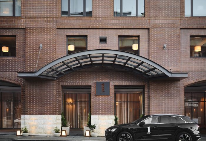 1 Hotel San Francisco entrance. Gay-friendly hotel with car. Brick building, modern design. Ideal for gay travel in San Francisco.