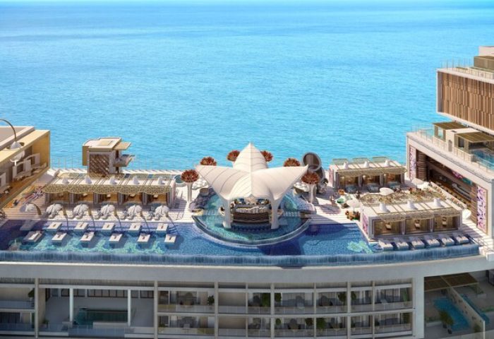 Atlantis The Royal gay-friendly hotel rooftop pool with ocean view. Luxury travel destination for gay men. Stylish bar & lounge areas.