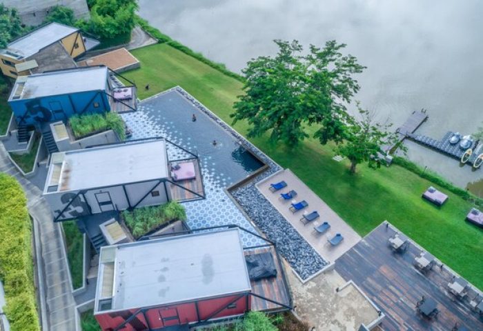 Cross River Kwai gay-friendly hotel aerial view. Unique design, riverside pool, and modern architecture. A perfect gay travel destination.