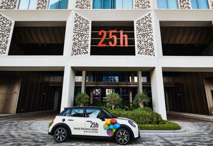 25hours Hotel One Central facade with a branded Mini Cooper. A gay-friendly hotel, offering unique experiences for gay travelers.