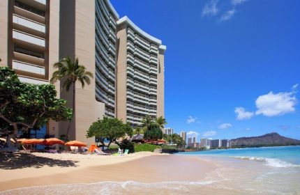 Sheraton Waikiki Beach Resort, a gay-friendly hotel. Beach view with Diamond Head. Perfect for LGBTQ+ travel & gay vacations in Honolulu, Hawaii.