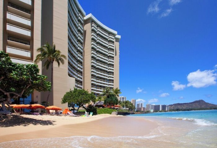 Sheraton Waikiki Beach Resort, a gay-friendly hotel. Beach view with Diamond Head. Perfect for LGBTQ+ travel & gay vacations in Honolulu, Hawaii.
