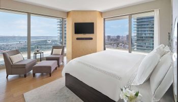 Raffles Istanbul Hotel gay-friendly room. Modern bedroom interior with city view. Luxury hotel for gay travel in Istanbul. Gay hotel.