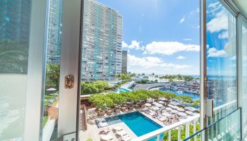 View from The Modern Honolulu, a gay-friendly hotel. See the pool, marina, and ocean. A perfect vacation club for gay men's travel.