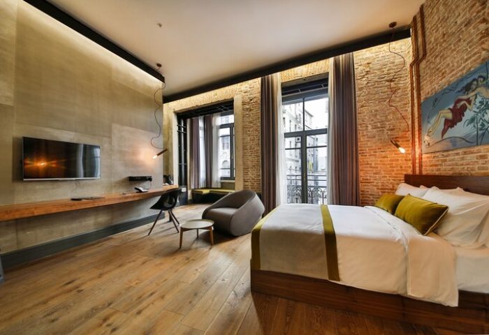 Hotel The Public Special Category room. Gay-friendly hotel. Modern design with exposed brick, wood floors, and city view. Comfortable and stylish.
