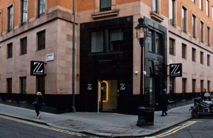 The Z Hotel Trafalgar exterior. Gay-friendly hotel in London with modern architecture. Entrance with 'Z' logo. Ideal for gay men travel.