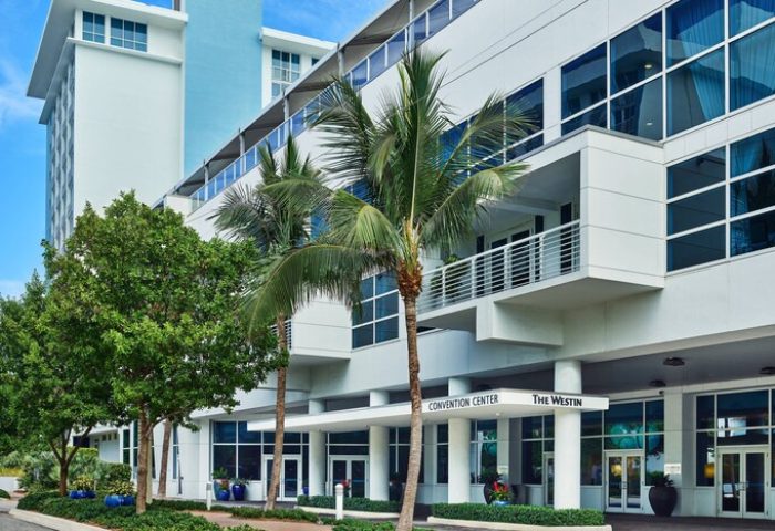 The Westin Fort Lauderdale Beach Resort entrance. Gay-friendly hotel with palm trees. Convention Center access. Great for gay travel.