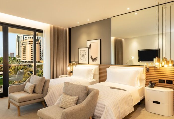 Le Royal Méridien Beach Resort gay-friendly hotel room. Two beds, balcony view. A great choice for gay men's travel.