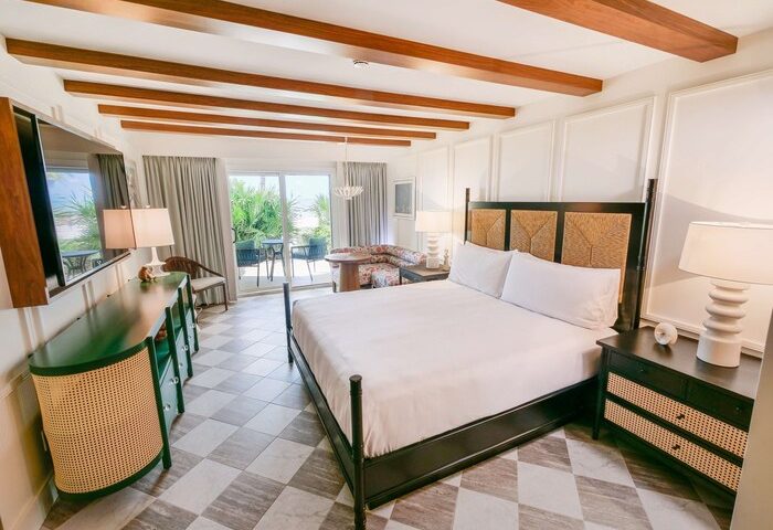Casa Marina Key West, Curio Collection by Hilton guest room. Balcony view. Gay-friendly hotel with stylish decor for gay men travel.