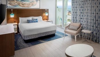 The Reach Key West, Curio Collection by Hilton hotel room. Gay-friendly hotel with a bed, balcony, and ocean view.