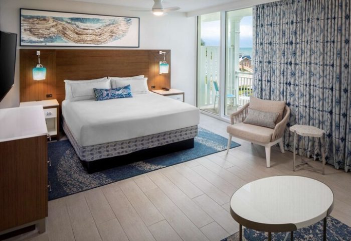 The Reach Key West, Curio Collection by Hilton hotel room. Gay-friendly hotel with a bed, balcony, and ocean view.