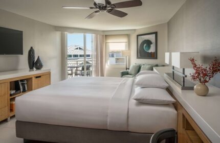 Hyatt Centric Key West Resort: A gay-friendly hotel room with a king bed, balcony, and modern decor. Perfect for LGBTQ+ travelers seeking relaxation.