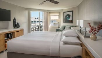 Hyatt Centric Key West Resort: A gay-friendly hotel room with a king bed, balcony, and modern decor. Perfect for LGBTQ+ travelers seeking relaxation.