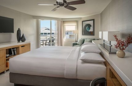 Hyatt Centric Key West Resort: A gay-friendly hotel room with a king bed, balcony, and modern decor. Perfect for LGBTQ+ travelers seeking relaxation.