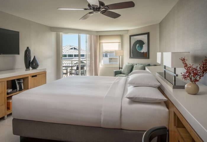 Hyatt Centric Key West Resort: A gay-friendly hotel room with a king bed, balcony, and modern decor. Perfect for LGBTQ+ travelers seeking relaxation.