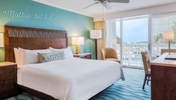 Opal Key Resort and Marina room. Gay-friendly hotel with marina view. Nothin' but a Breeze wall art above the bed. Balcony overlooking the water.