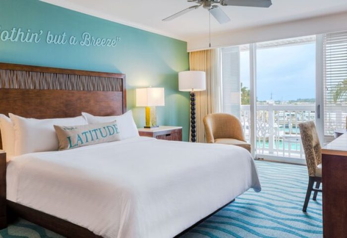 Opal Key Resort and Marina room. Gay-friendly hotel with marina view. Nothin' but a Breeze wall art above the bed. Balcony overlooking the water.