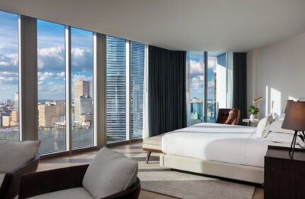 Kimpton EPIC Hotel gay-friendly room. Panoramic city views from a modern, luxurious suite. Ideal for gay travel in Miami.