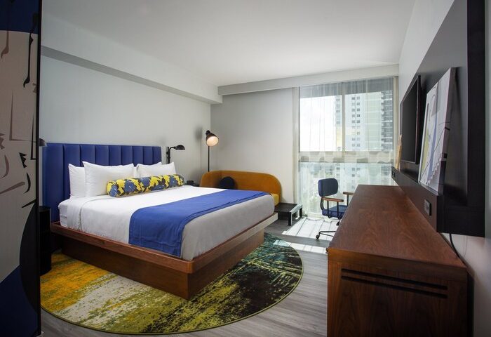 Hotel Indigo Miami Brickell gay-friendly room. Modern decor, king bed, blue accents, city view. Ideal for gay travelers.