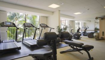 Halekulani Hotel's gym with treadmills, weights, and fitness equipment. This gay-friendly hotel offers a great workout space for travelers.