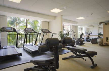 Halekulani Hotel's gym with treadmills, weights, and fitness equipment. This gay-friendly hotel offers a great workout space for travelers.