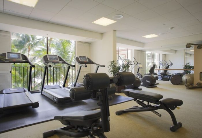Halekulani Hotel's gym with treadmills, weights, and fitness equipment. This gay-friendly hotel offers a great workout space for travelers.