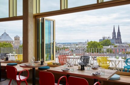 25hours Hotel The Circle's gay-friendly restaurant. Tables set with city views. A great choice for gay men's travel in Cologne.