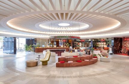 25hours Hotel The Circle lobby interior. A gay-friendly hotel with a unique circular design, perfect for gay travel and a memorable stay.