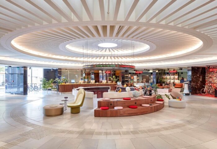 25hours Hotel The Circle lobby interior. A gay-friendly hotel with a unique circular design, perfect for gay travel and a memorable stay.