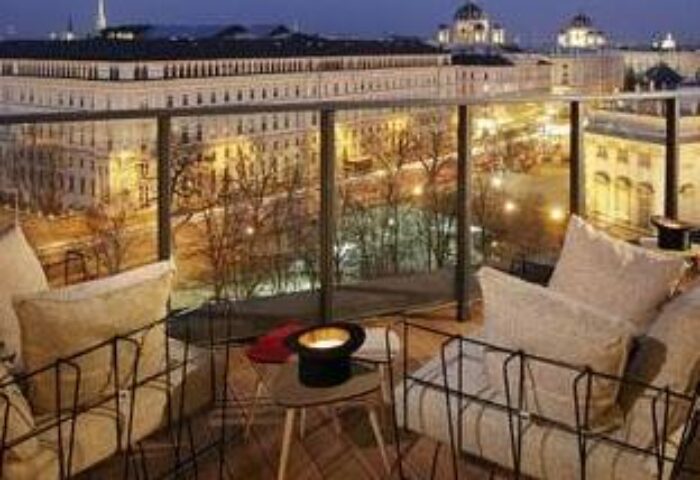 25hours Hotel beim MuseumsQuartier balcony view at night. Gay-friendly hotel with city views in Vienna, Austria. Travel advice for gay men.