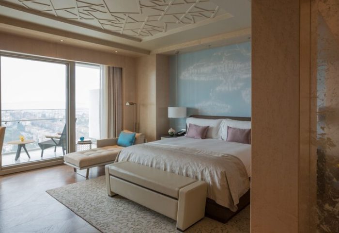 Raffles Istanbul Hotel: Gay-friendly hotel room with balcony view. Luxury bedding, stylish decor, and modern amenities for gay travelers.
