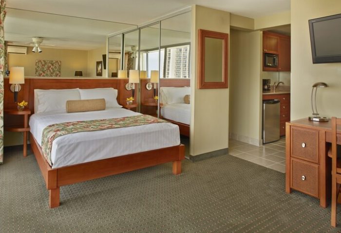 Pacific Monarch Hotel gay-friendly room. King bed, mirrored closet, kitchenette with microwave and mini-fridge. Ideal for gay travel.