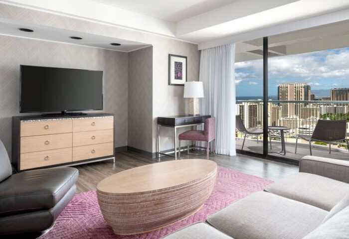 Sheraton Princess Kaiulani gay-friendly hotel room with balcony view. Modern design, comfortable for LGBTQ+ travelers. Waikiki hotel room.