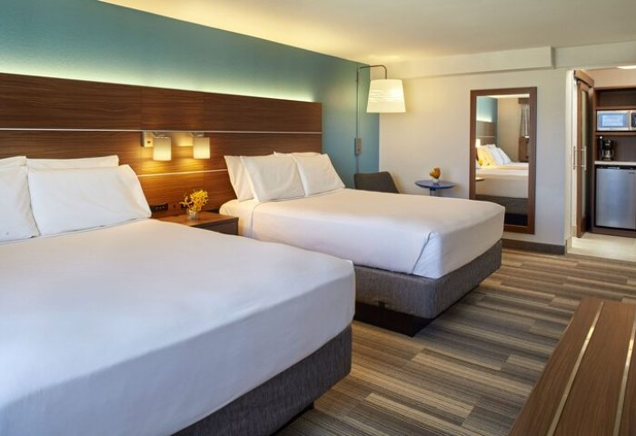Holiday Inn Express Waikiki gay-friendly hotel room. Two queen beds, microwave, fridge, and coffee maker. Great for gay travel.